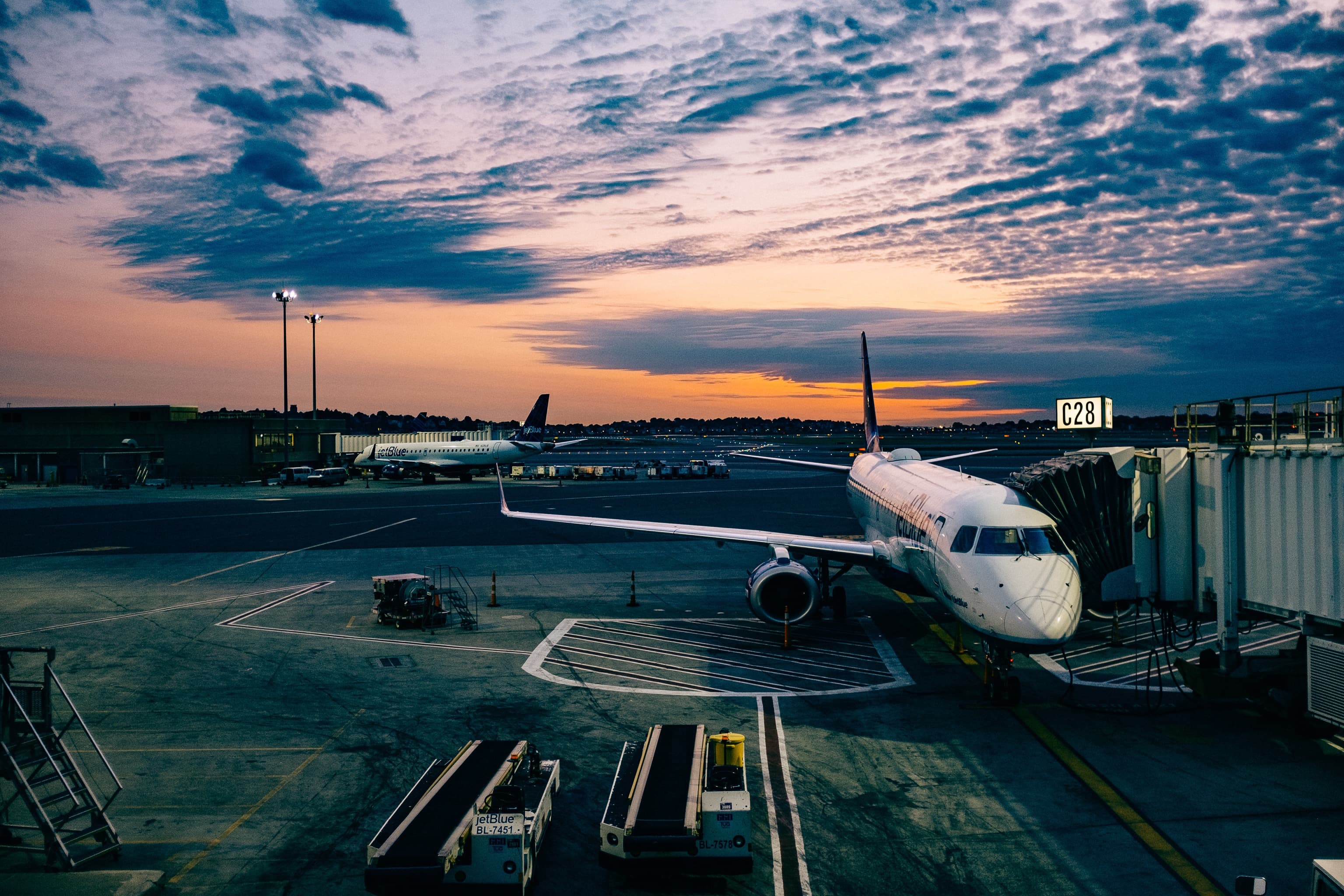 JetBlue aircraft at Logan Airport Terminal C at dusk